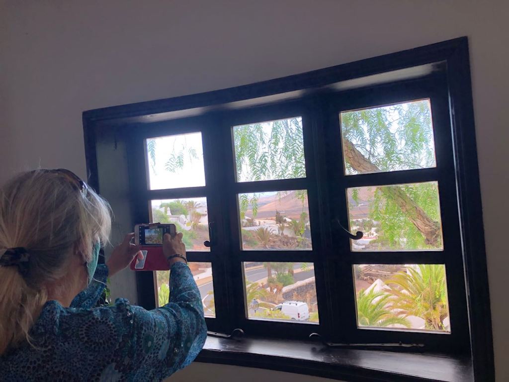 Pauline taking a pic out of the kitchen window